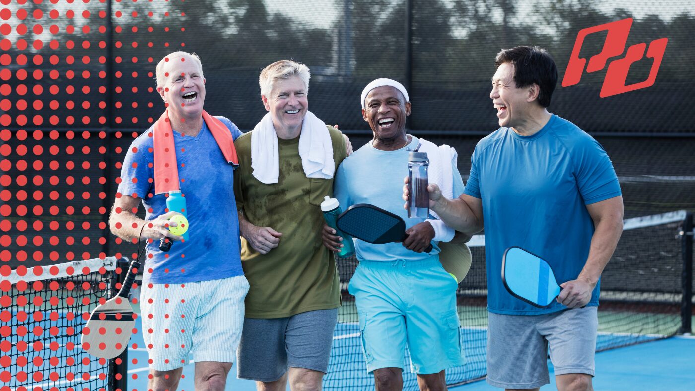 Group of pickleball players smiling after a match