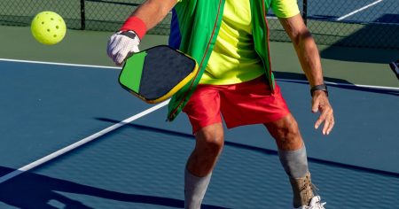 Can You Play Pickleball With Bad Knees? Close up of a man's knees while he's playing pickleball