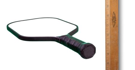 How to Measure the Grip Size for Your Pickleball Paddle A pickleball paddle and a ruler