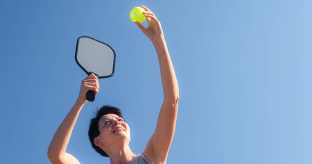 Best Pickleball Drills for Advanced Players Woman doing a pickleball serve drill