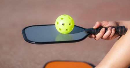 What Is The Best Weight For A Pickleball Paddle? Player balancing a pickleball ball on a paddle