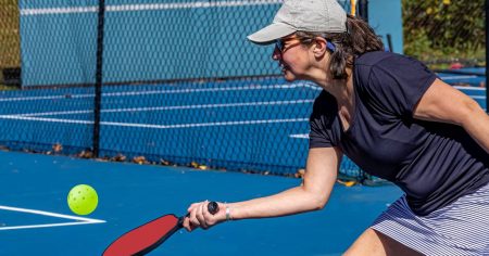 What is the Third Shot Drop in Pickleball? Woman hitting a drop shot in pickleball