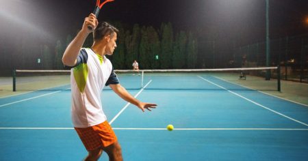 Man hitting a tennis ball