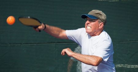 What Is A Smash In Pickleball? Man hitting a smash in pickleball