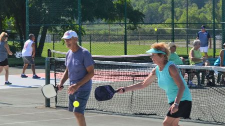 Donald Bouchard and Joyce Ashdon on the refurbished courts at Kellogg Community College - image by Bill Broderick, Battle Creek Enquirer