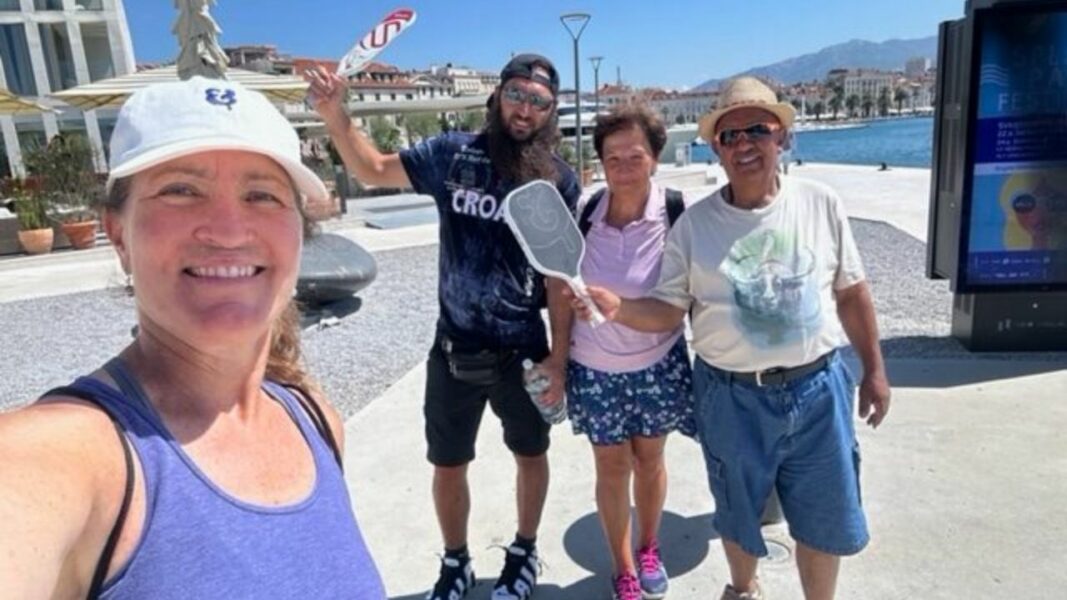Penny Eifrig stands with Ukrainian and Canadian pickleball enthusiasts - image courtesy of Penny Eifrig