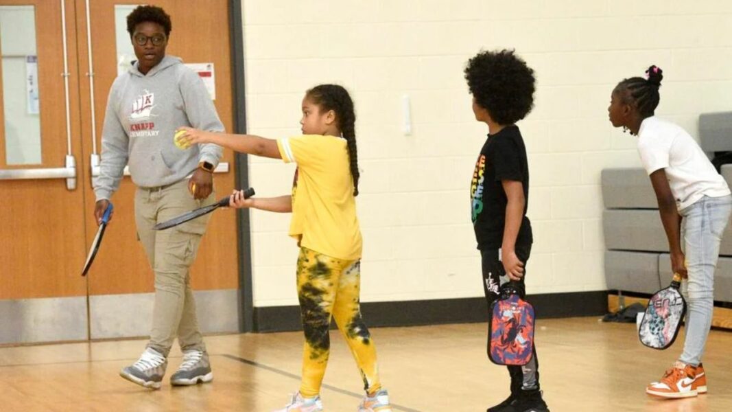 Zyaire Strowder, left, practices with fourth grader Jovon Williams - image courtesy of Ryan Strowder, The Journal Times