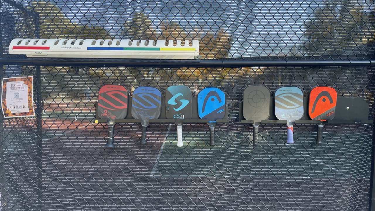 Paddles on the fence at Eisenhower Park - image by Catie Cheshire