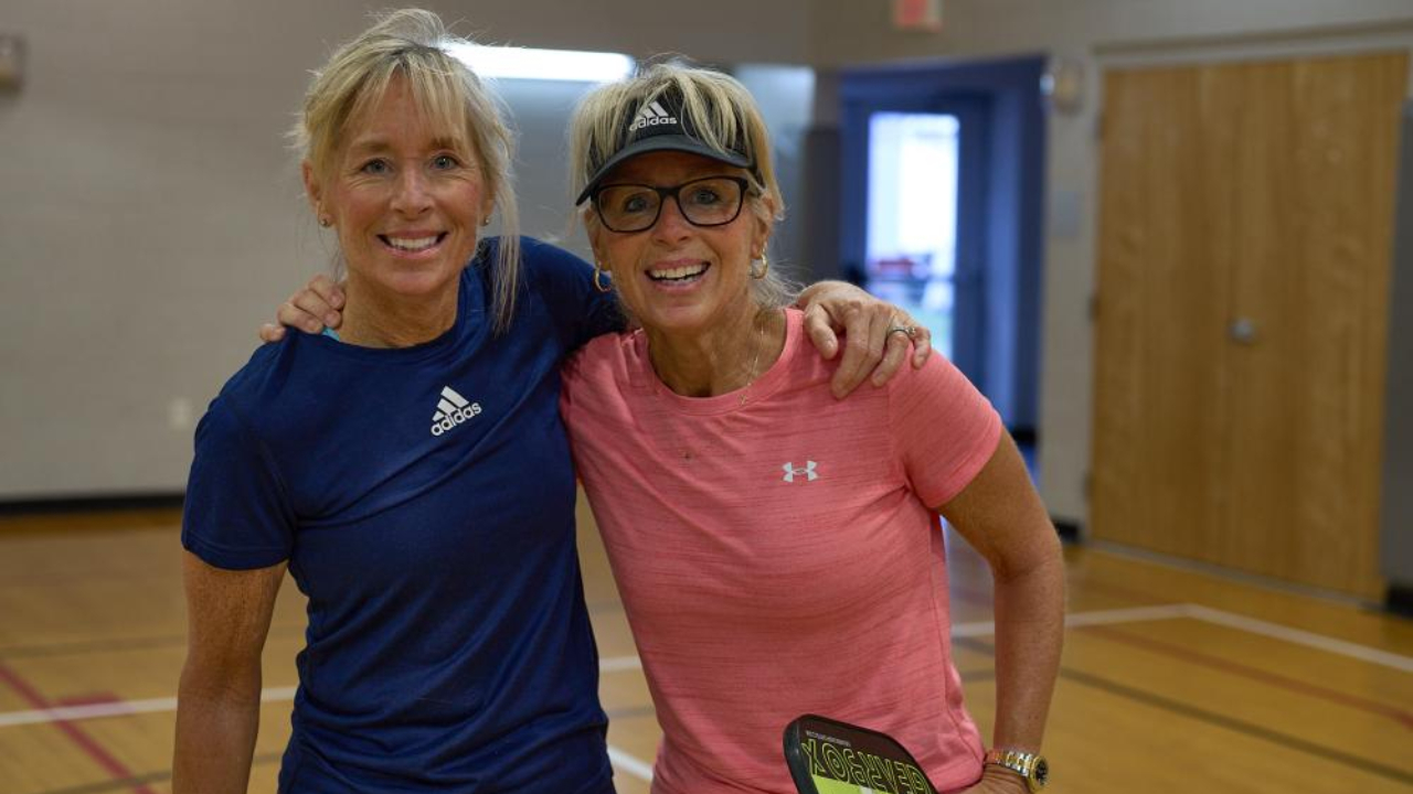 Sisters Lynne Veloso and Lee McCaffery at the Gleason Family YMCA, MA- Image by James Gage
